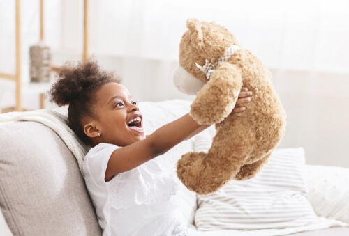 Kid with store teddy bear