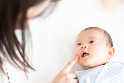 Sensory play for babies: Start with a baby massage.