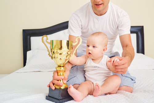 Baby Holding a Reward