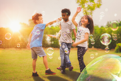 Children playing with bubbles