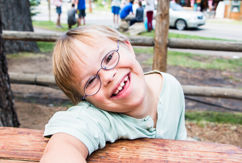 boy with down syndrome smiling