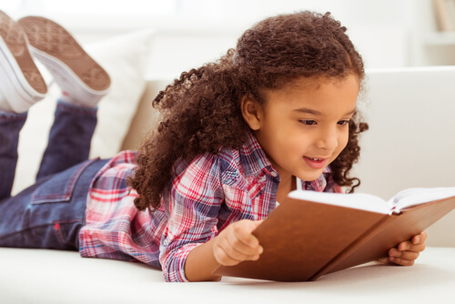 child using a dictionary to grow vocabulary