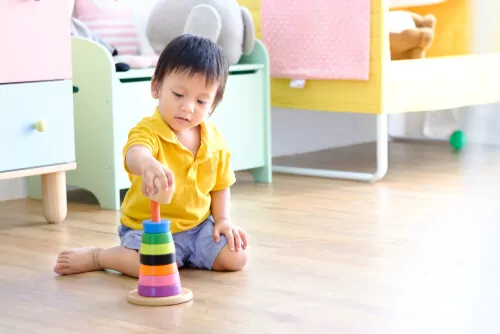 kid building a tower